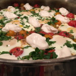 Lamb With Blistered Tomatoes, Braised Eggs, and Tahini